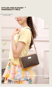 Detailed view of vintage patterned crossbody bag with metallic logo and leather strap