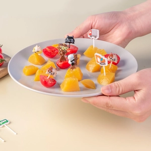 Japanese style animal and car fruit picks for kids bento lunch boxes set in a gray plate
