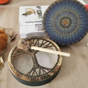 Detail of Shaman drums with Tree of Life and Mandala patterns plus a fur-tipped mallet