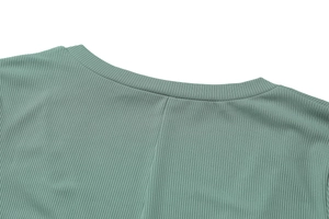 Close-up of crew neckline on a ribbed knit slim fit bodysuit in sage green color