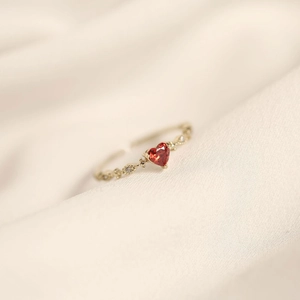 Elegant adjustable S925 silver heart ruby ring with white zircon accents on silk background