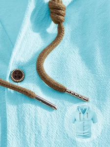 Detail of light blue linen short sleeve hooded shirt with drawstring and retro button