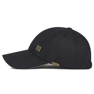 Black cotton baseball cap with golden Chinese character plaque and curved brim detail