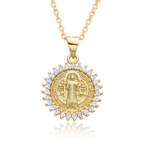 Macro detail of a 18k gold religious pendant necklace with zircon and Latin engraving