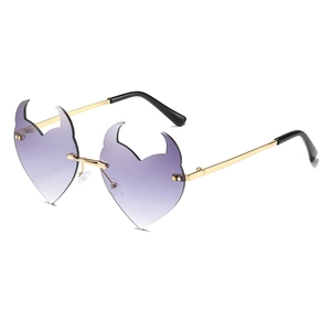Frameless heart-shaped sunglasses with purple gradient lenses and devil horn gold metal frame