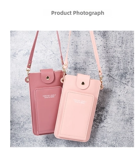 Detail of minimalist leather phone crossbody bags in pink tones with golden hardware