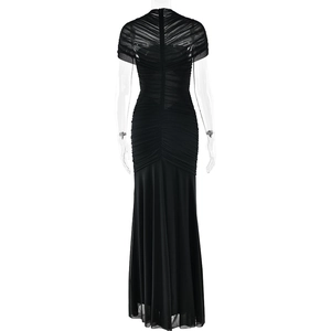 Detailed back view of a black fishtail dress featuring sheer mesh and pleated texture