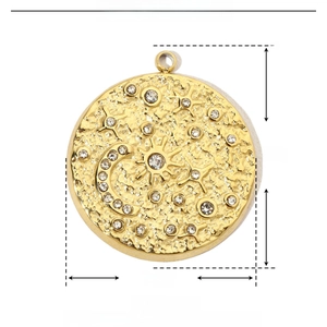 Detailed view of round celestial pendant with star and moon patterns and rhinestones