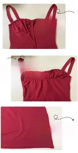 Detail view of burgundy slip dress with pleated neckline, lace-up design and hidden zipper
