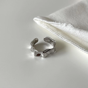 Macro shot of S925 sterling silver ring featuring an irregular textured lava surface