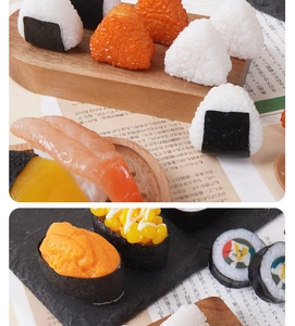 Close-up of realistic sushi and onigiri keychain models with vivid textures on a wooden plate