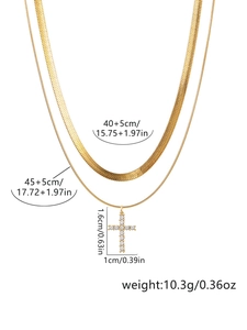 Detailed view of gold snake chain and cross pendant necklace with size and weight specs