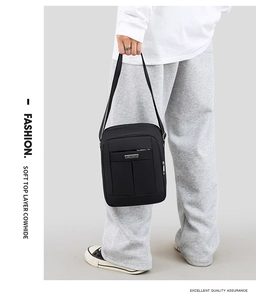Close-up of premium black top layer cowhide leather texture on men's shoulder bag