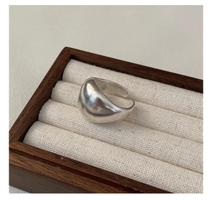 Macro shot of polished S925 sterling silver ring showing the internal hallmark stamp