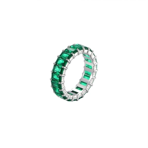 Elegant emerald-cut green gemstone eternity ring with silver polished metal band