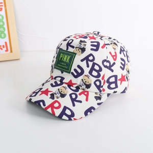 Detail of kids baseball cap featuring colorful cartoon bear and alphabet prints on canvas