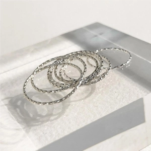 Detailed view of S925 sterling silver rings with precision diamond-cut textured surface