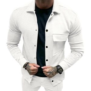 Detailed view of white corduroy shirt jacket featuring a chest pocket and metallic buttons