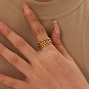 Vintage hollow leaf pattern gold titanium steel ring with triple-layer beaded edges