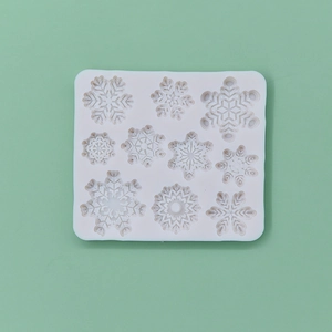 White snowflake silicone mold with ten different patterns for baking and DIY cakes