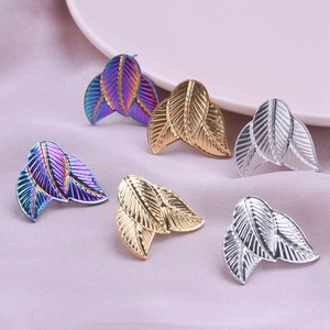 Detailed view of fish-tail 304 stainless steel earrings in gold silver and rainbow