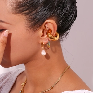 Chic 18K gold plated knotted earrings and freshwater pearl studs on female model