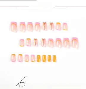 Detail view of 24pcs press-on nails with pink and orange wave tips and gold glitter