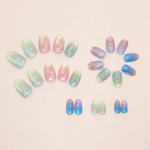 Detail of gradient press-on nails with cat-eye glitter and 3D embossed texture
