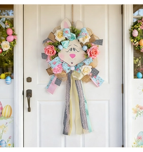 Detail of Easter door wreath with wooden bunny face, faux roses and colorful ribbons