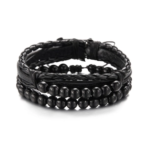 Detail view of multi-layer black leather braid and frosted stone bead bracelets