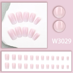 Detail view of pink gradient square press-on nails featuring a set of 24 glossy nail pieces