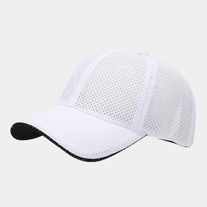 Close-up of white mesh baseball cap with breathable fabric and black contrast piping