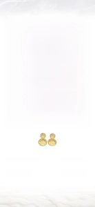 Detailed view of women's round gold alloy earrings with textured electroplating finish