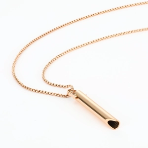 Detailed view of rose gold mindfulness breathing pendant with a classic box chain