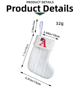 White knitted Christmas stocking with red letter A embroidery showing detailed size dimensions