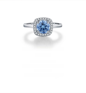 Macro view of blue halo moissanite ring showing S925 silver stamp and detailed stone setting