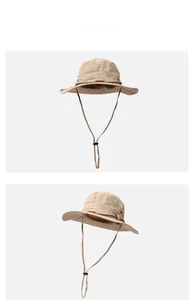 Détail du chapeau de pêcheur kaki avec aérations en maille et broderie de voyage