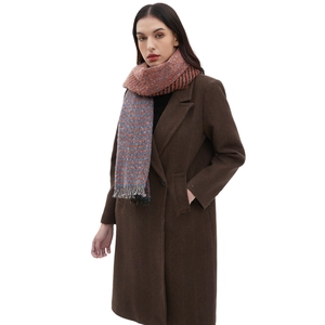 Winter unisex herringbone scarf with orange and blue fringe shawl on a brown wool coat