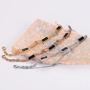 Three-color layered bracelets with black gemstone rectangular bars in gold and silver finish