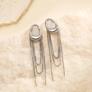 Sleek silver stainless steel tassel earrings with irregular hoops on natural stone