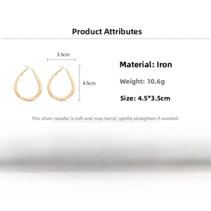 Detailed view of gold twisted teardrop hoop earrings showing size 4.5cm by 3.5cm
