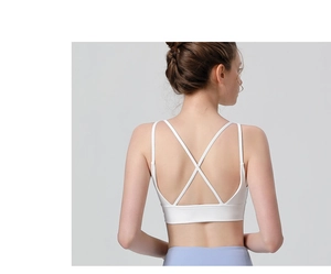 Detailed back view of white sports bra with criss-cross straps and elastic seamless fabric