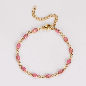 Detailed view of golden bracelet featuring pink glitter marquise charms and lobster clasp
