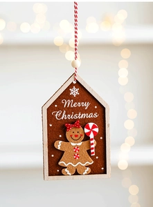 Detail of wooden gingerbread girl ornament with Merry Christmas text and felt background