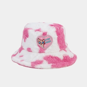 Detail of pink cow print faux fur bucket hat with heart cat embroidery patch