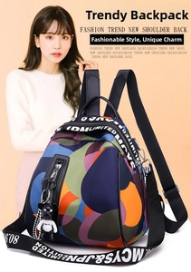 Detail of colorful geometric print backpack with side zipper pocket and cute bear charm