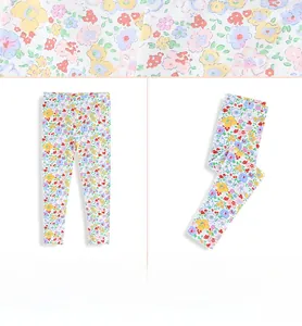 Close-up of high-quality cotton fabric with colorful floral pattern for girls' leggings