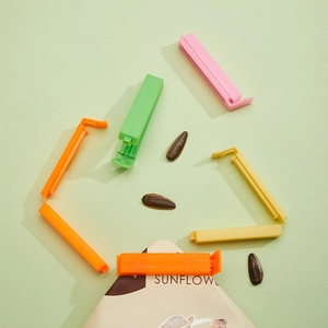 Set of colorful plastic food sealing clips in pink, green, yellow and orange colors