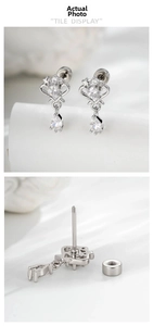 Detailed macro view of heart crown stud earrings with pear shaped zircon and screw back