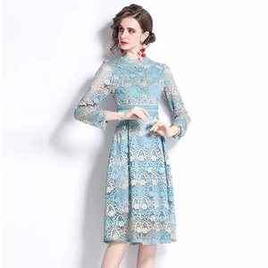 Elegant light blue lace A-line dress with beige lining and long sleeves shown on a model